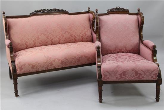 An early 20th century mahogany framed two seat sofa and matching armchair,